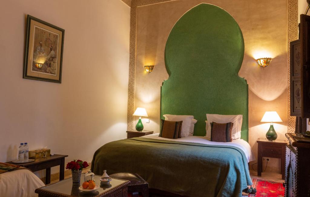 Postel nebo postele na pokoji v ubytování Les Sources Berbères Riad & Spa