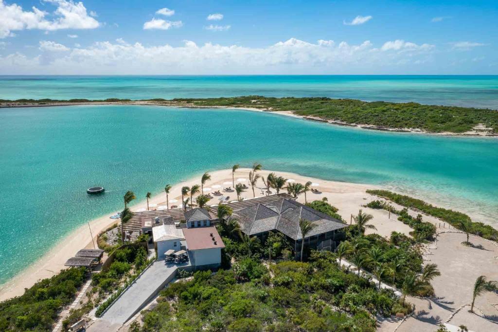 an aerial view of a house on a beach at Ambergris Cay Private Island All Inclusive - Island Hopper Flight Included in Big Ambergris Cay