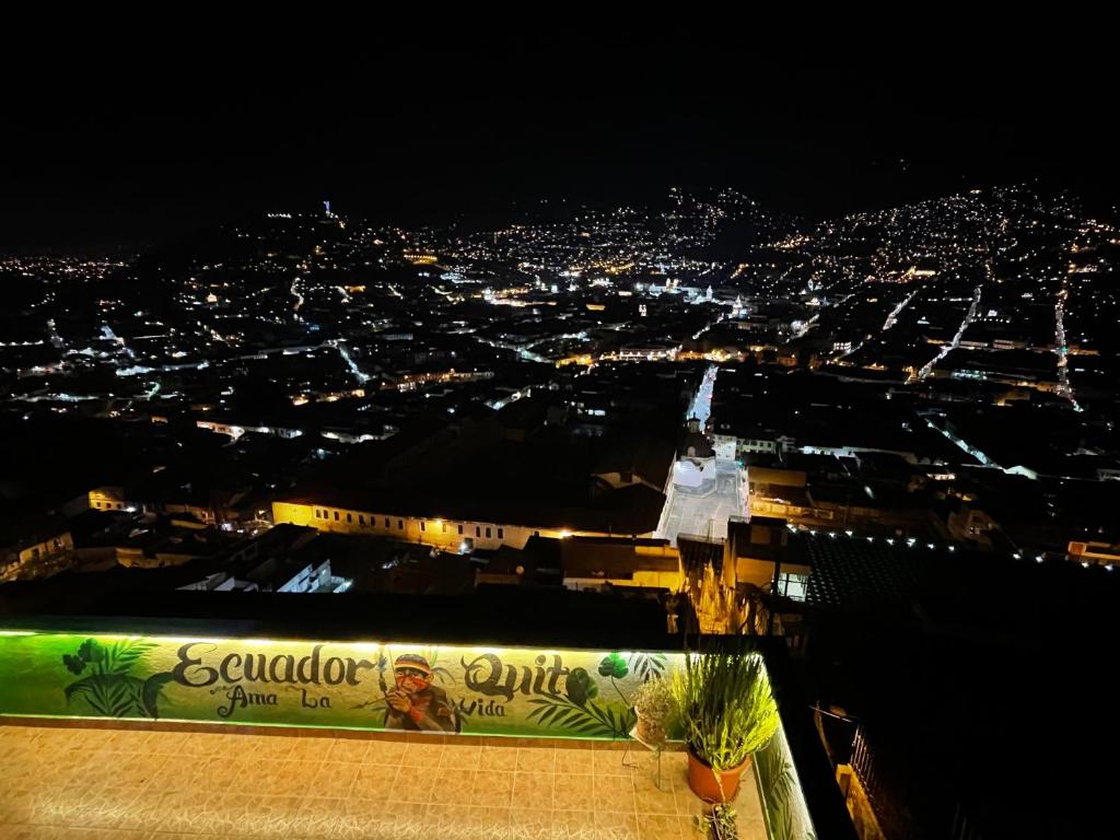 a view of a city at night at ITCHIMBIA GARDEN con la mejor vista de Quito y SPA in Quito