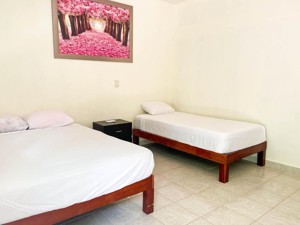 Postel nebo postele na pokoji v ubytování Hotel Vias Maya Bacalar