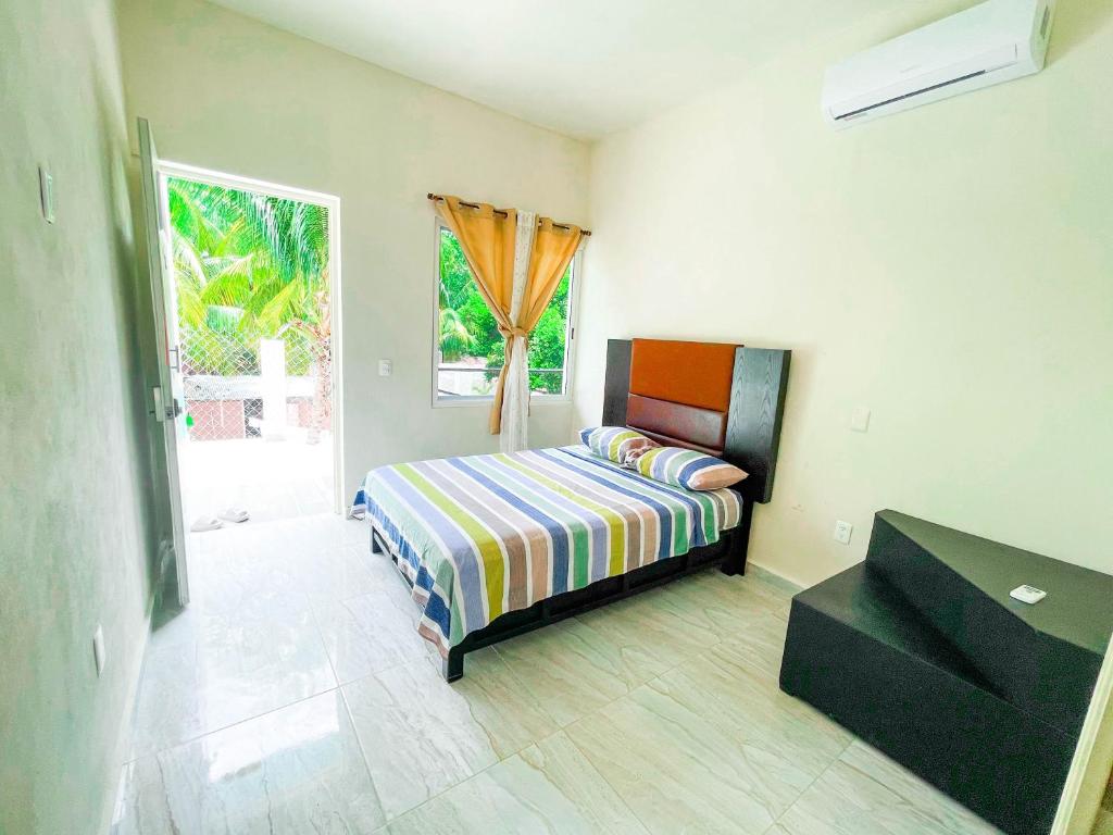 Postel nebo postele na pokoji v ubytování Hotel Vias Maya Bacalar