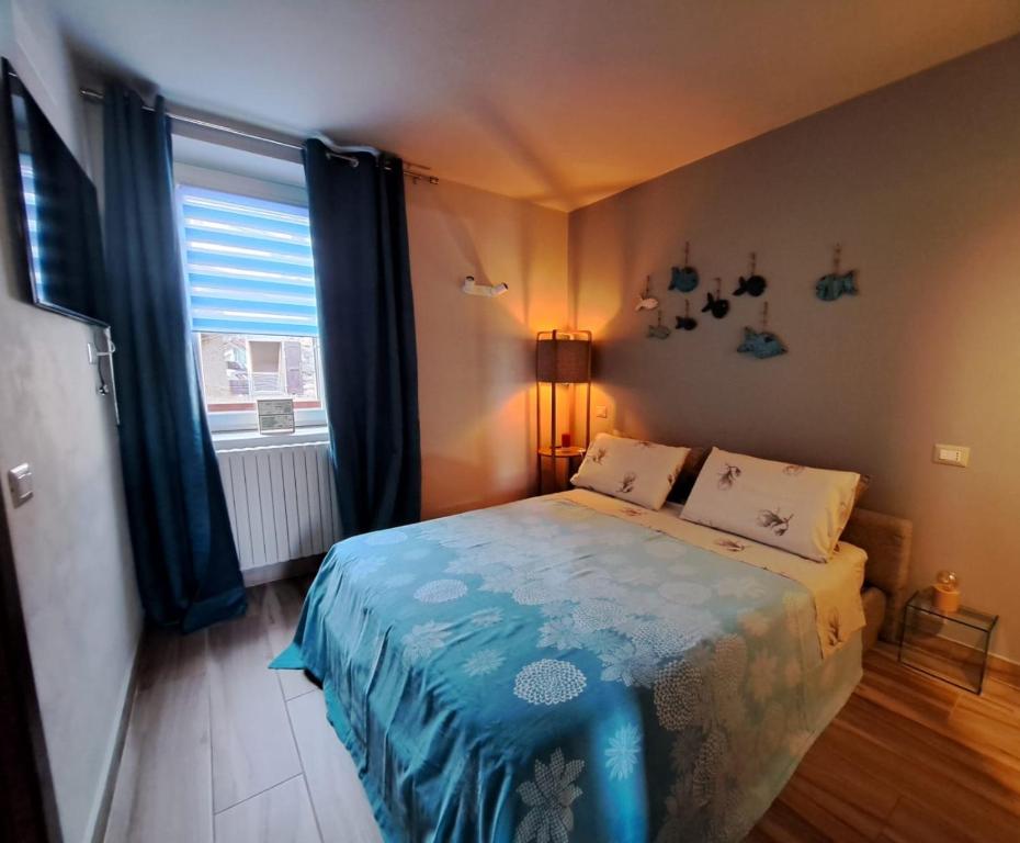 Postel nebo postele na pokoji v ubytování Magnolia@27 Lake Iseo