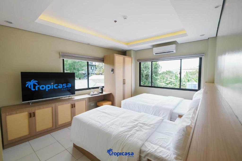Postel nebo postele na pokoji v ubytování Tropicasa Hotel