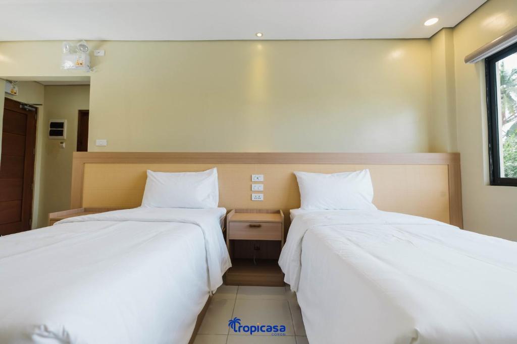 Postel nebo postele na pokoji v ubytování Tropicasa Hotel