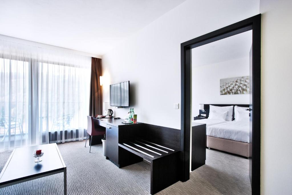 Postel nebo postele na pokoji v ubytování Wellness Hotel Vista