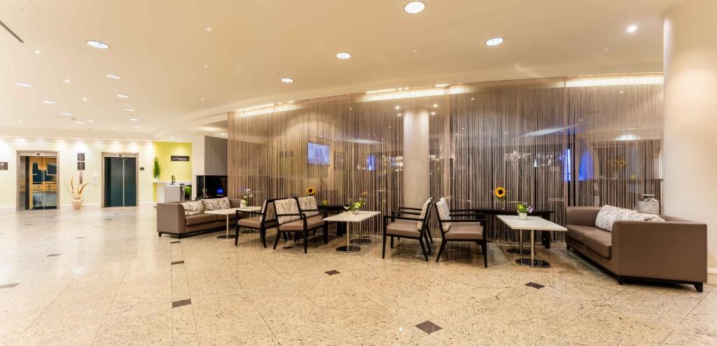 TV a/nebo společenská místnost v ubytování PLAZA Premium Wien