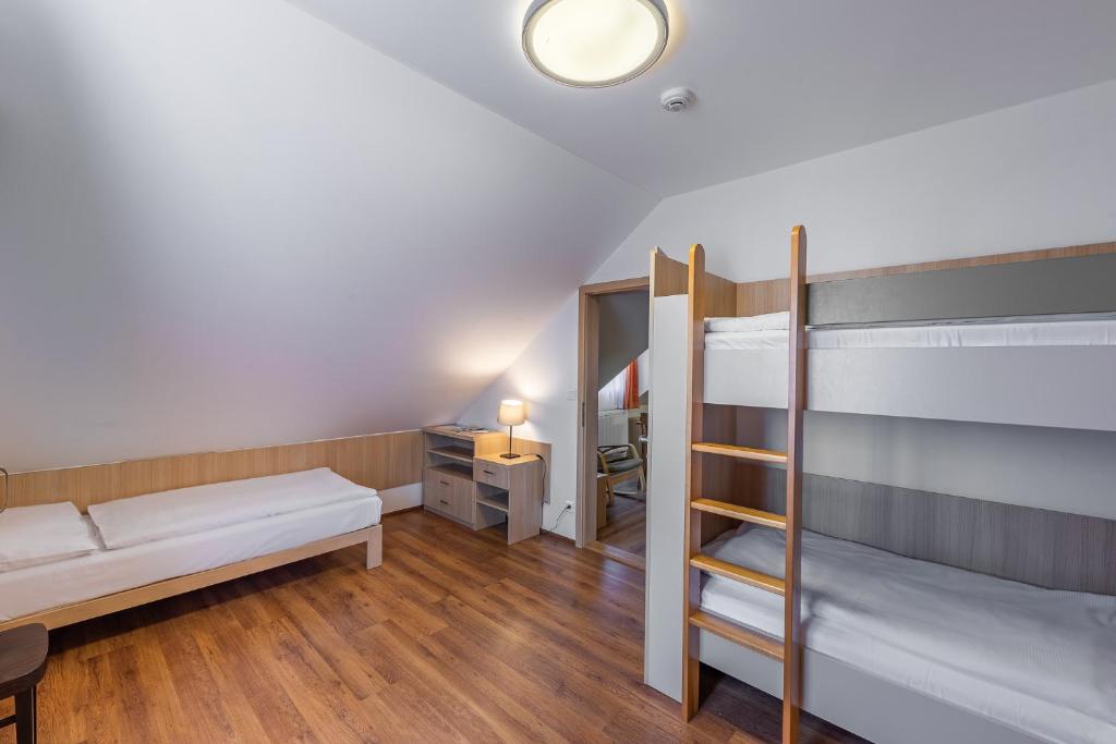 Postel nebo postele na pokoji v ubytování Penzion Terezka