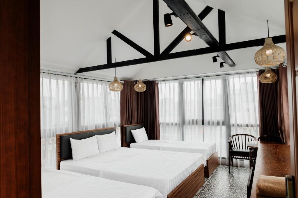 Postel nebo postele na pokoji v ubytování Tabalo Hostel Hanoi