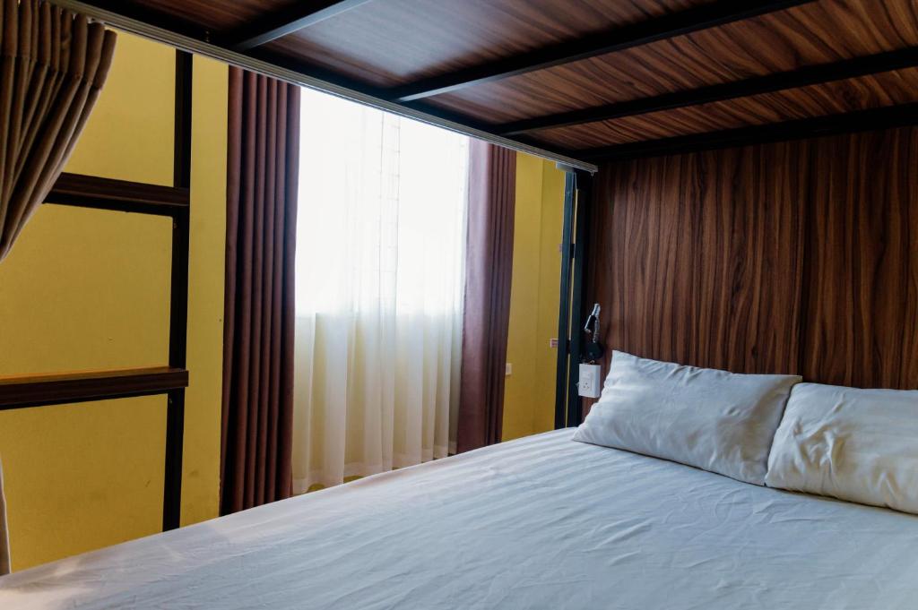 Postel nebo postele na pokoji v ubytování Tabalo Hostel Hanoi