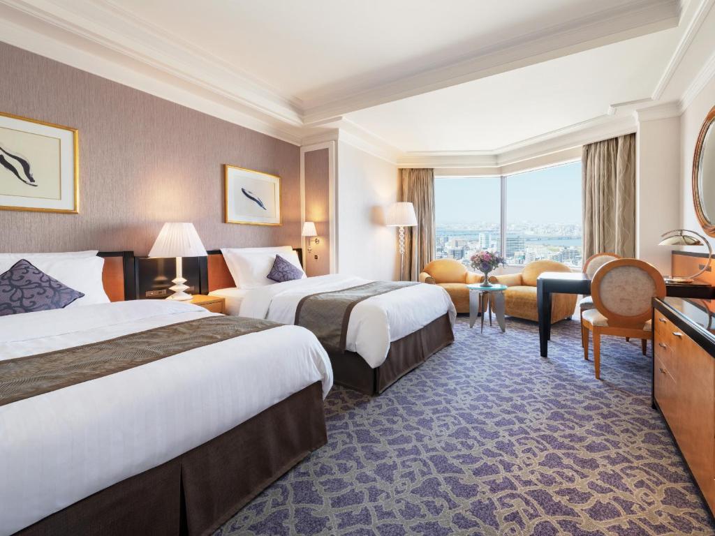 Postel nebo postele na pokoji v ubytování Hotel Hankyu International