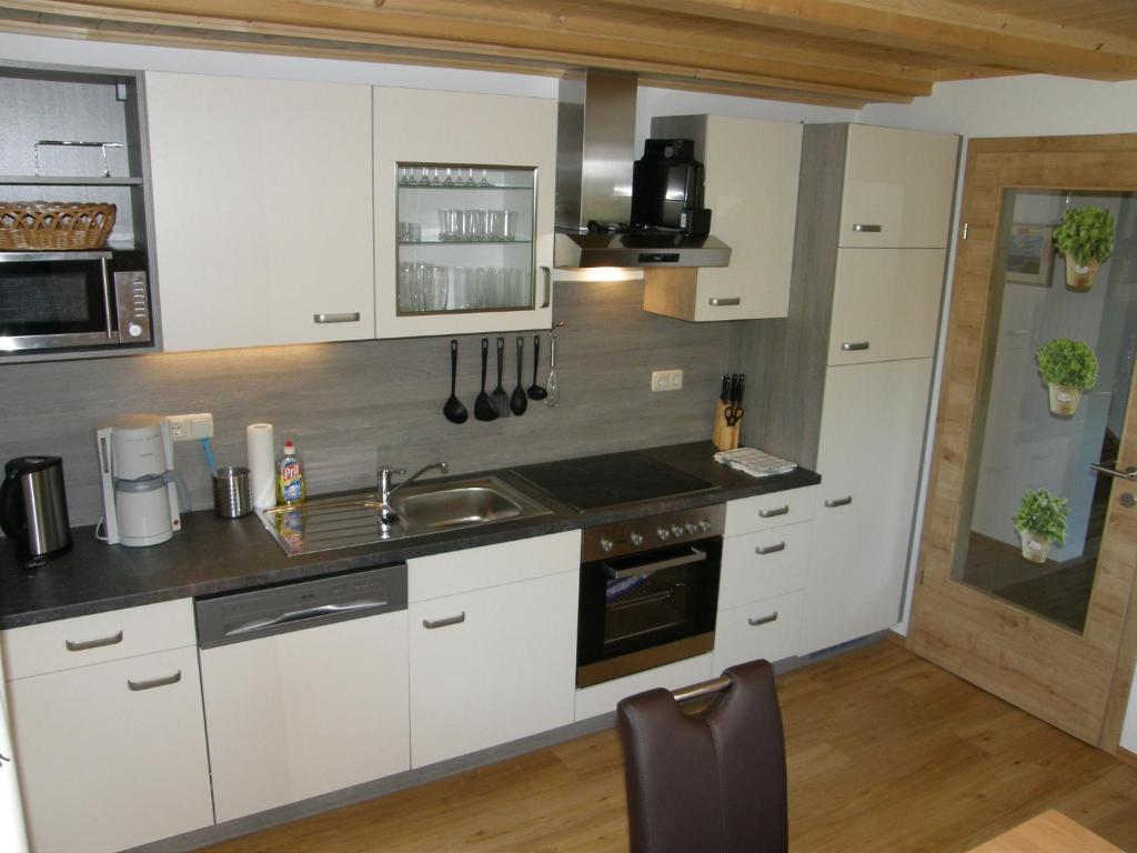 Kuchyň nebo kuchyňský kout v ubytování Apartment Altaussee