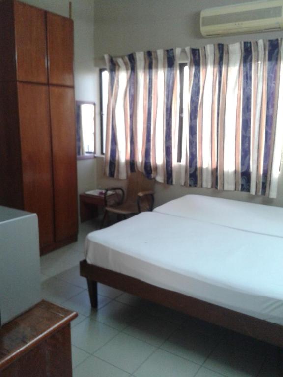 Postel nebo postele na pokoji v ubytování HotelMalaya
