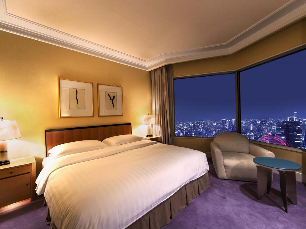 Postel nebo postele na pokoji v ubytování Hotel Hankyu International