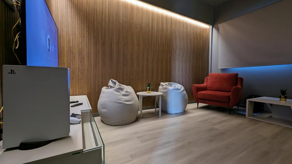 TV o dispositivi per l'intrattenimento presso SUNSET CLIFFS sea view apartments