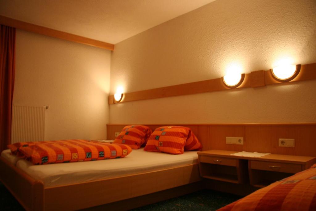 Postel nebo postele na pokoji v ubytování Haus Alpina