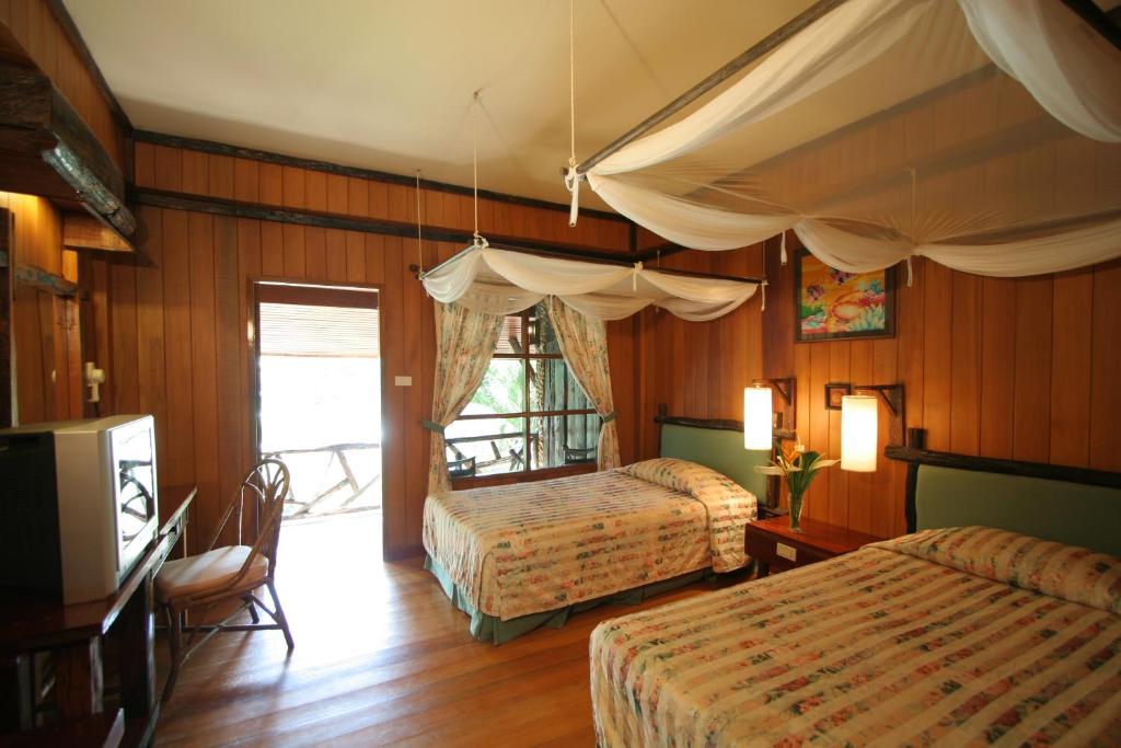 Postel nebo postele na pokoji v ubytování Banpu Koh Chang Resort