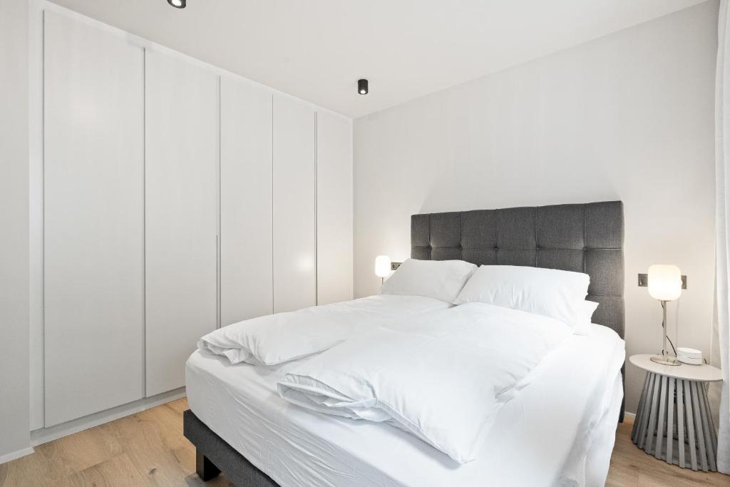 Postel nebo postele na pokoji v ubytování Brand New Downtown Harbor Apartment