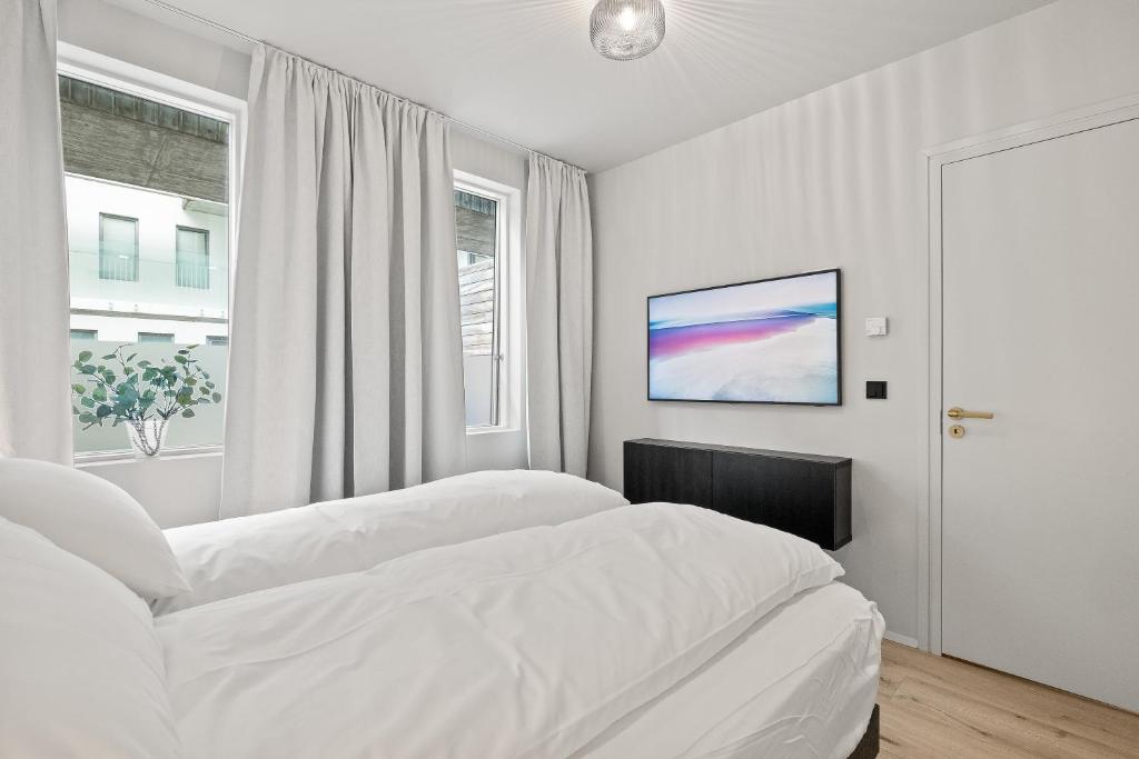 Postel nebo postele na pokoji v ubytování Brand New Downtown Harbor Apartment