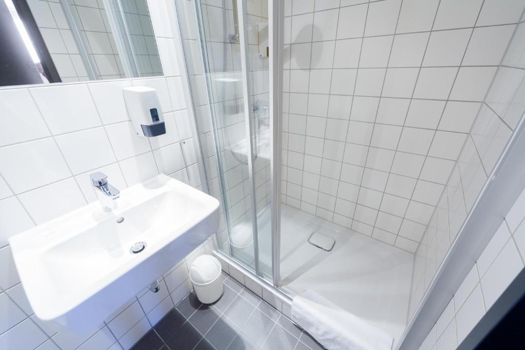 Koupelna v ubytování McDreams Hotel Leipzig