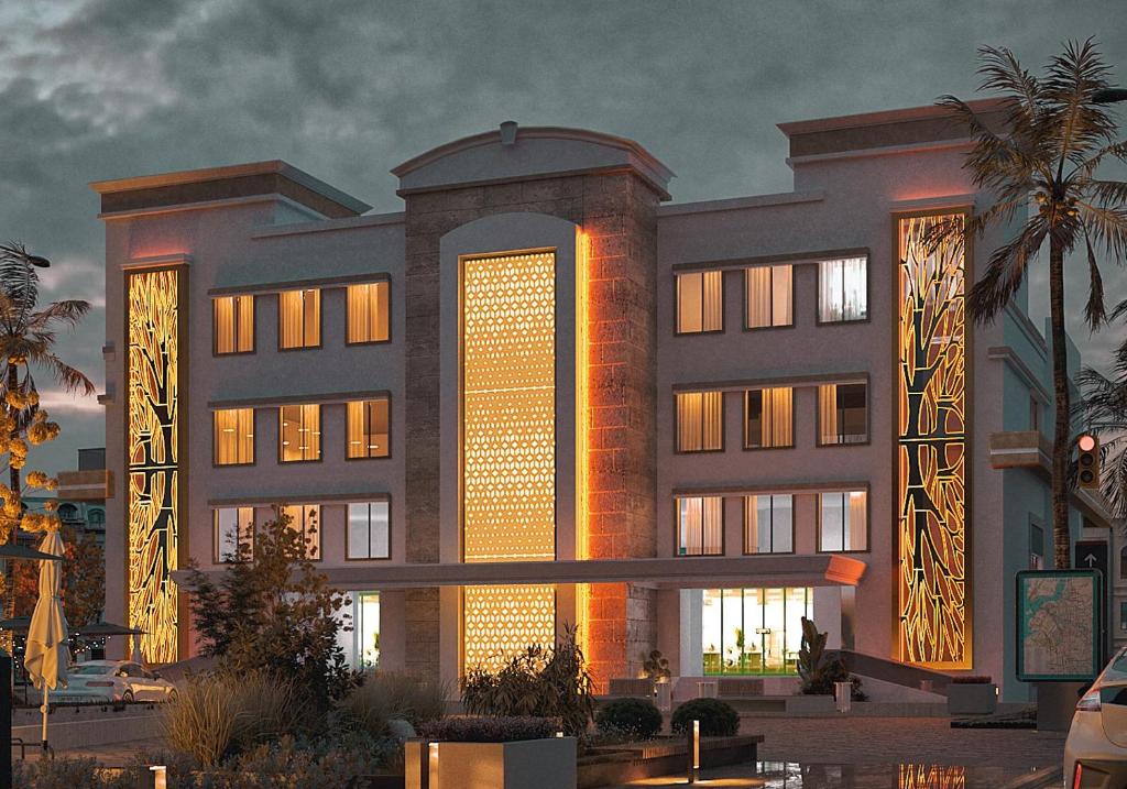 a rendering of a building with lights on at PUSHPAK HOTEL & CONVENTION in Bhubaneshwar
