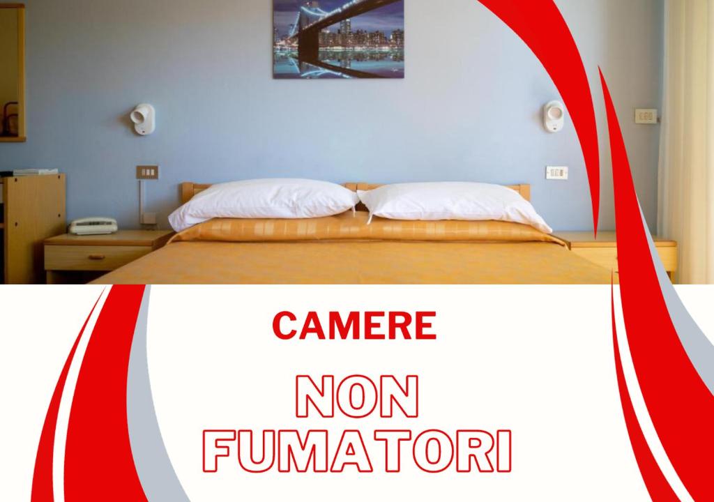 Postel nebo postele na pokoji v ubytování Hotel Quattro Palme