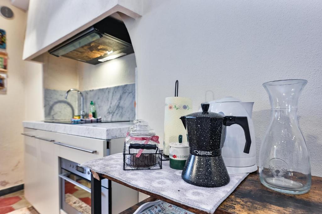 A kitchen or kitchenette at Baiàn Casa Vacanze