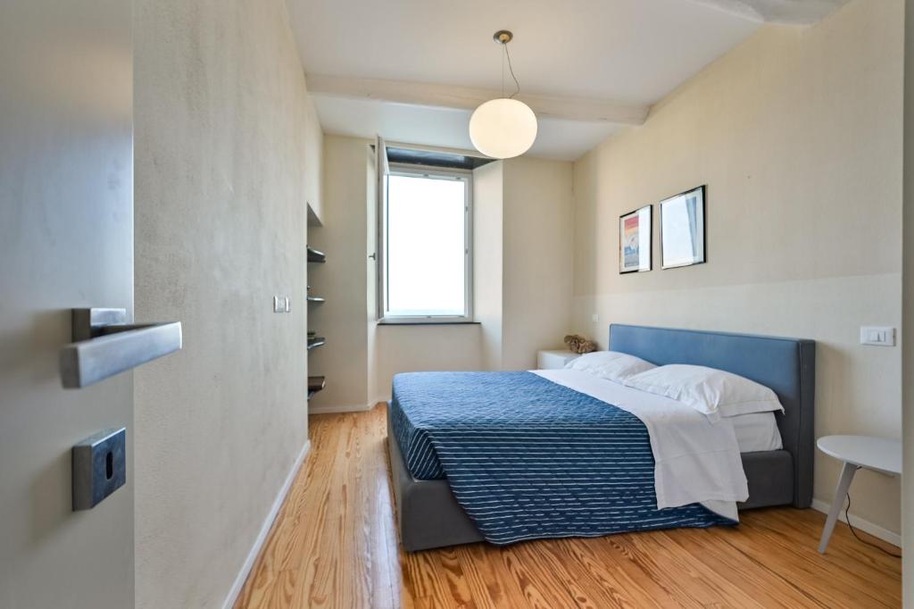 A bed or beds in a room at Baiàn Casa Vacanze