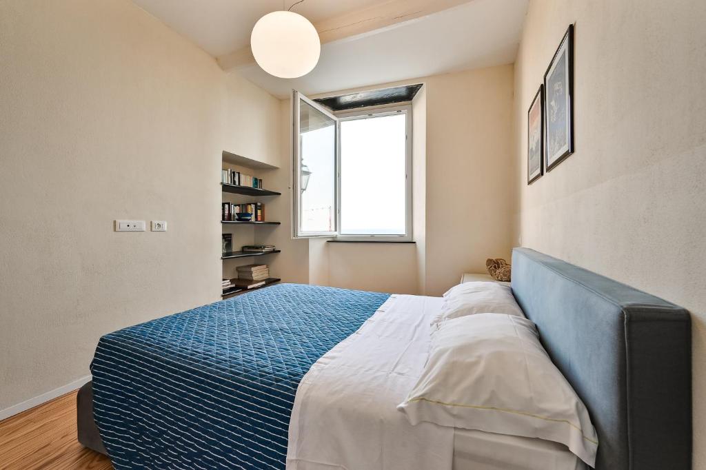 A bed or beds in a room at Baiàn Casa Vacanze