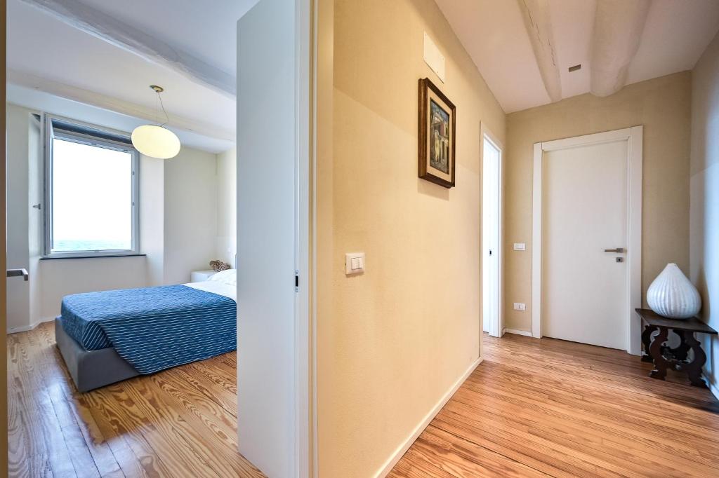 A bed or beds in a room at Baiàn Casa Vacanze