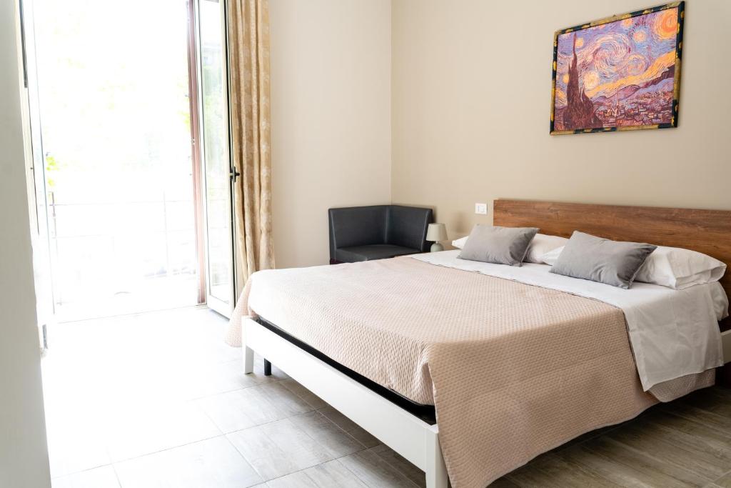 Postel nebo postele na pokoji v ubytování Gennaro Holidays Appartament