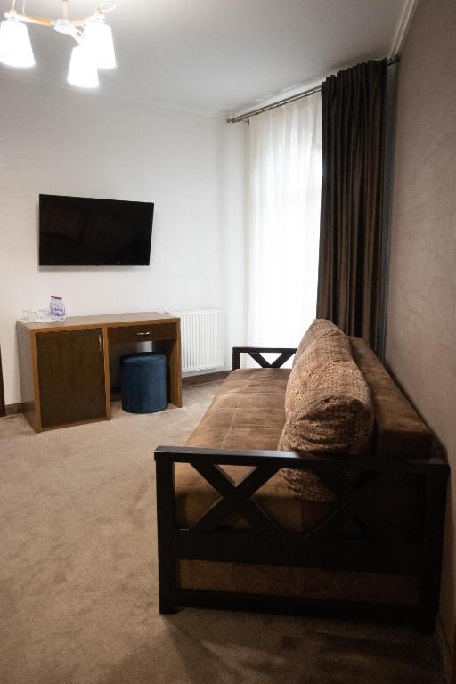 TV a/nebo společenská místnost v ubytování River Stone Hotel