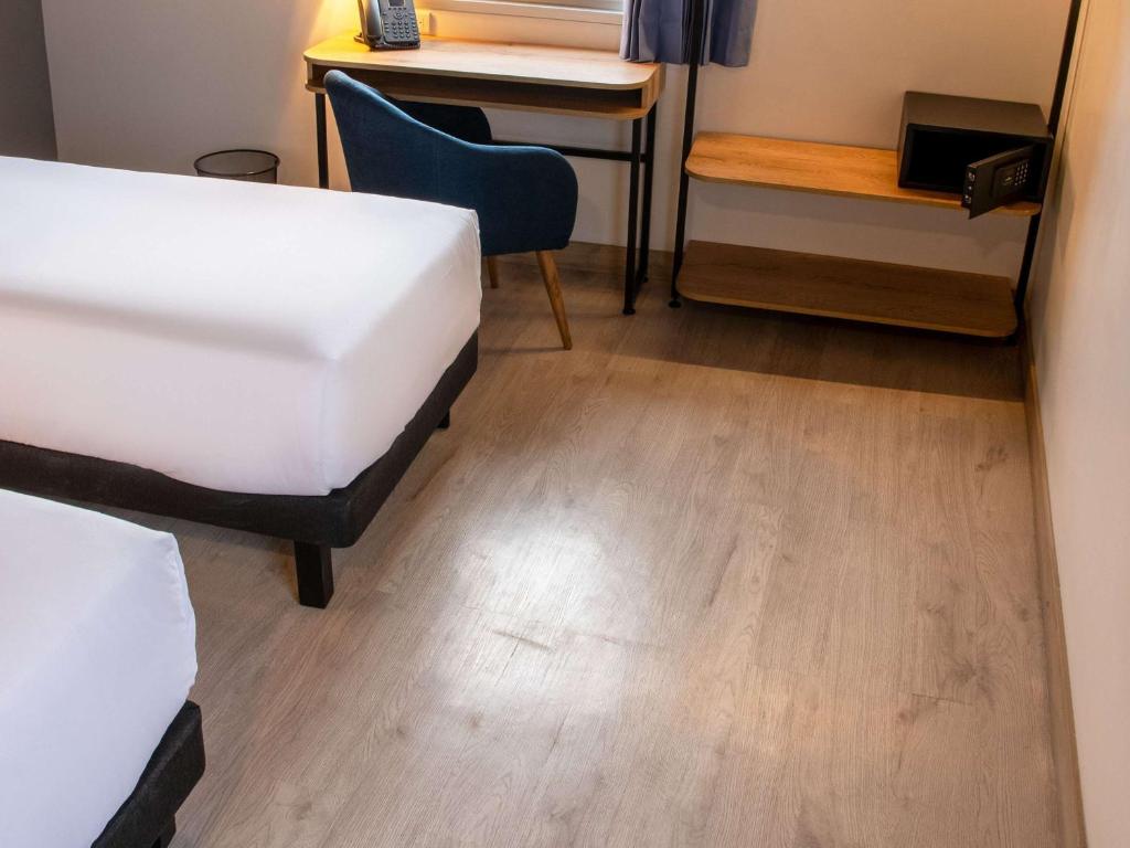 Postel nebo postele na pokoji v ubytování Ibis Styles El Malecon Guayaquil