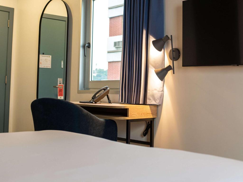 TV a/nebo společenská místnost v ubytování Ibis Styles El Malecon Guayaquil