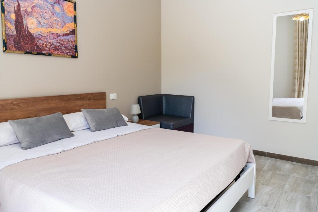 Postel nebo postele na pokoji v ubytování Gennaro Holidays Appartament
