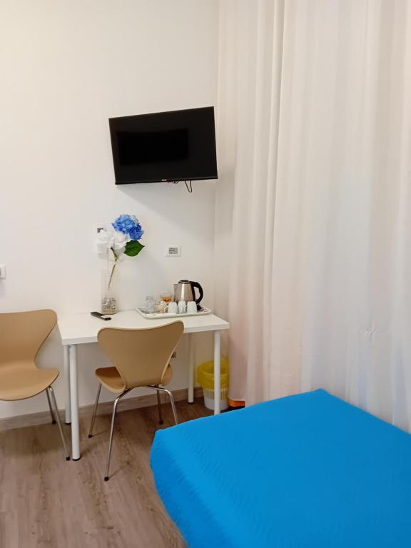 Postel nebo postele na pokoji v ubytování Titi Rooms