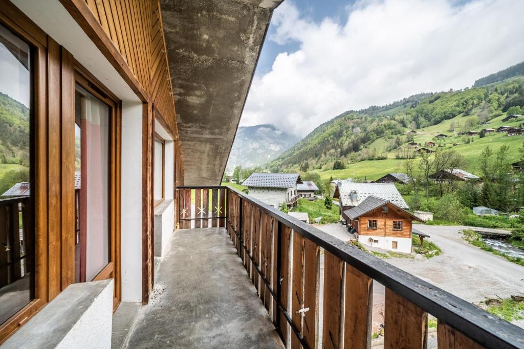 a balcony with a view of the mountains at Coeur de Charmy - 10 personnes in Abondance