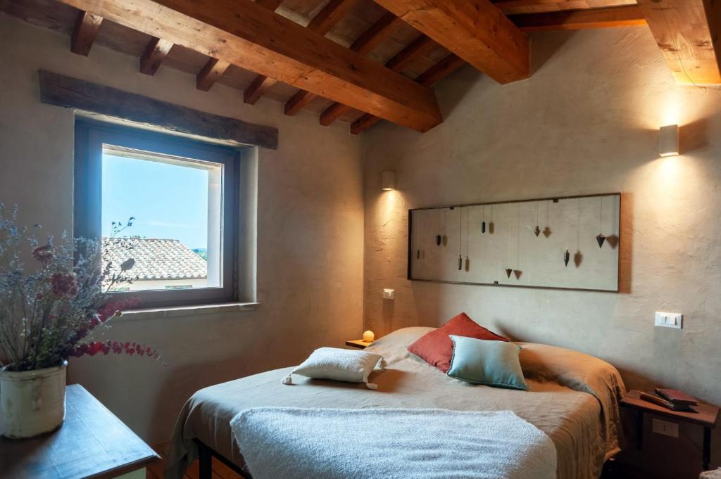 En eller flere senger på et rom på Agriturismo Borgo Malva'