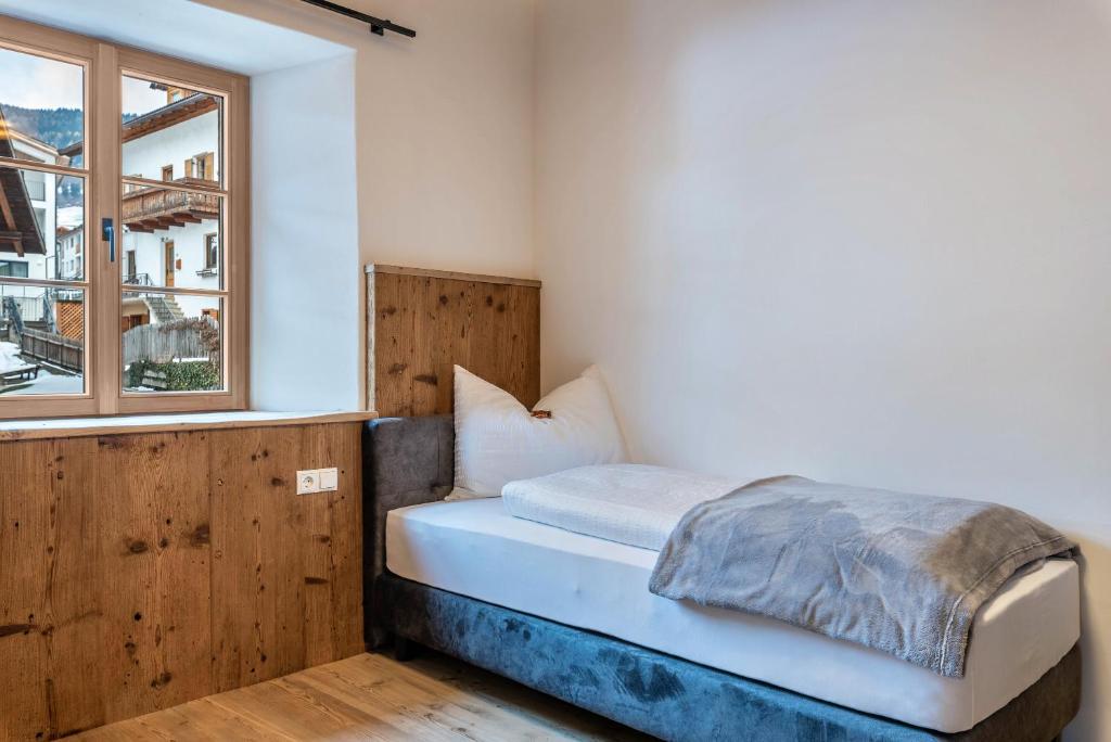 Postel nebo postele na pokoji v ubytování Alpin Chalet Samer Apt Bauernstube