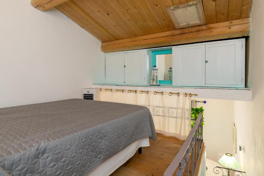 Łóżko lub łóżka w pokoju w obiekcie Casa del Pescatore