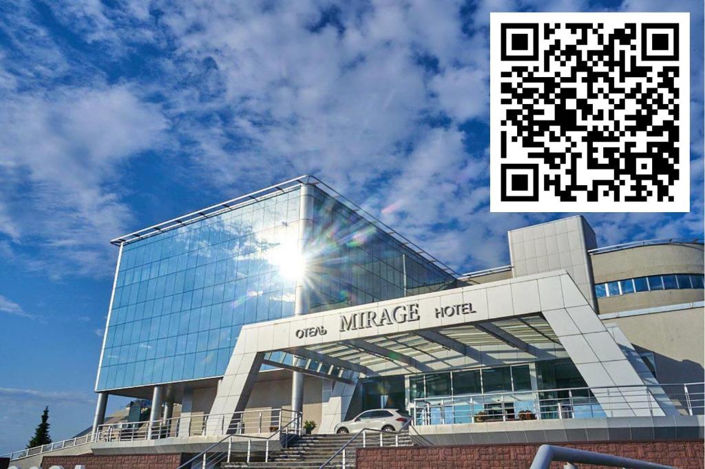 a glass building with the words one miracle motel at Mirage Hotel in Kazan