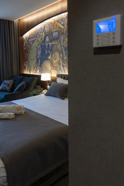Postel nebo postele na pokoji v ubytování Orienta Hotel Gyumri