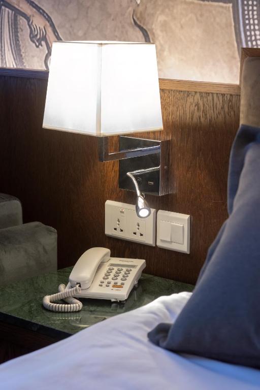 Postel nebo postele na pokoji v ubytování Orienta Hotel Gyumri