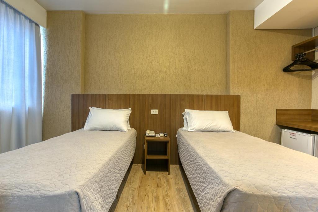 Cama ou camas em um quarto em Roochelle Hotel by Nobile