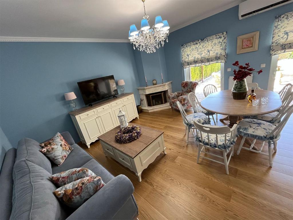 a living room with a couch and a table at Villa Myrto Nafpaktos in Nafpaktos