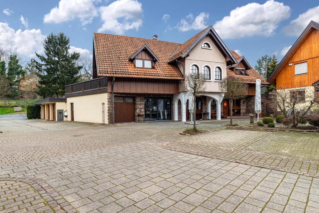 a large house with a brick driveway at Cheng in Baden-Baden