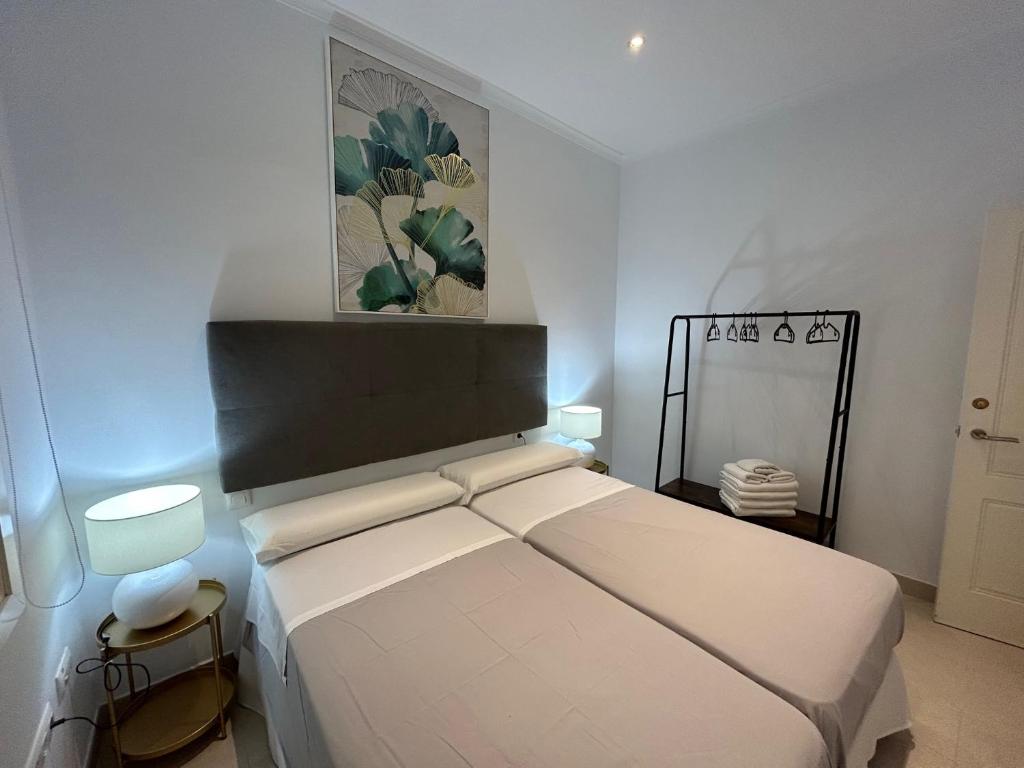 Postel nebo postele na pokoji v ubytování Olavide Premium Apartments