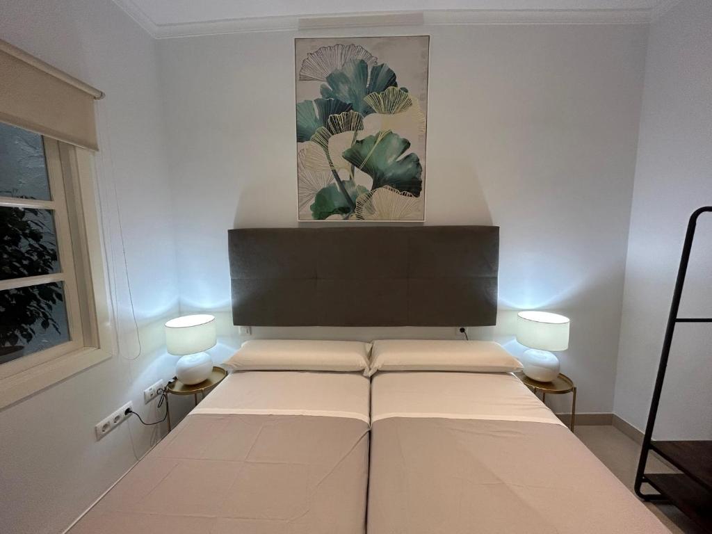Postel nebo postele na pokoji v ubytování Olavide Premium Apartments