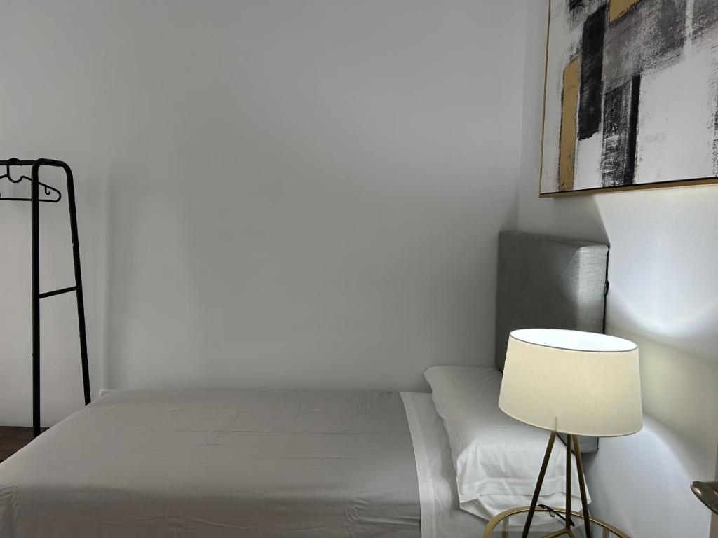 Postel nebo postele na pokoji v ubytování Olavide Premium Apartments