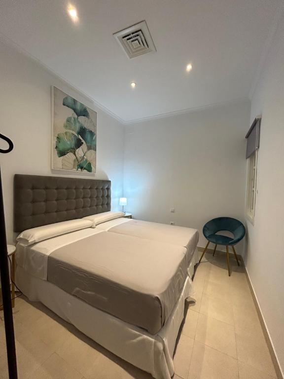 Postel nebo postele na pokoji v ubytování Olavide Premium Apartments