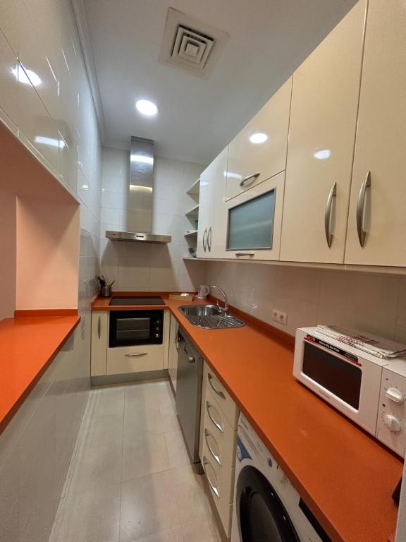 Kuchyň nebo kuchyňský kout v ubytování Olavide Premium Apartments